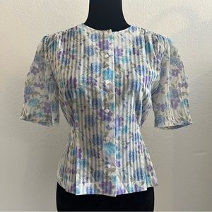 Vintage chiffon blouse with pin tucks details on waist and sleeves.